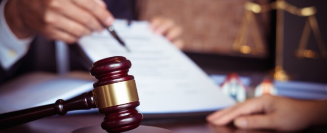 man holding a legal document for someone to sign, What is the Average Car Accident Lawyer Cost in California, Best Law PC