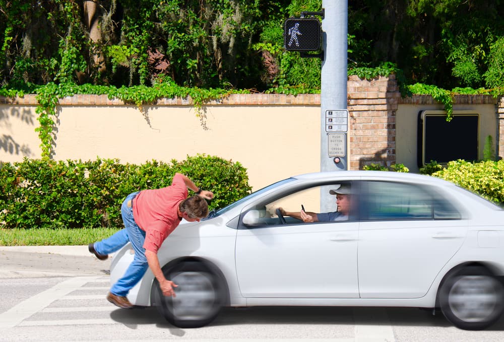 A speeding car hit a pedestrian on the crosswalk