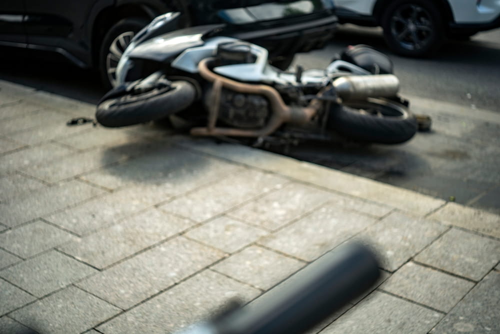 Motorcycle lying on the ground after a traffic collision in Los Angeles.